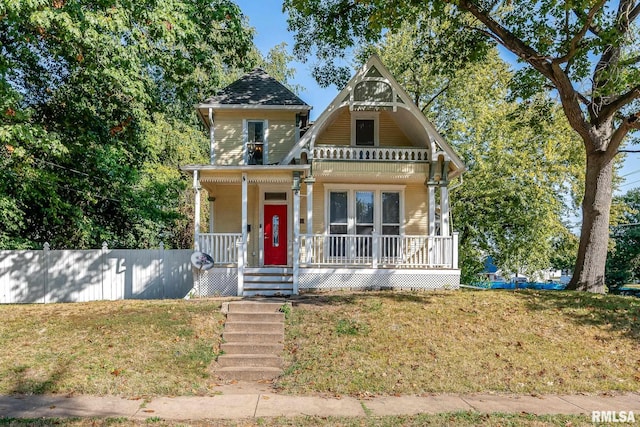 view of front of home featuring a porch and a front lawn