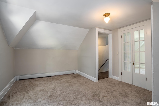 bonus room with vaulted ceiling, light colored carpet, and baseboard heating