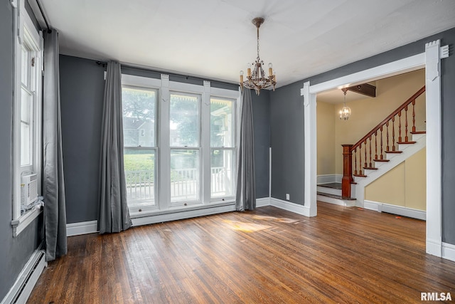 unfurnished room with an inviting chandelier, a baseboard radiator, and dark wood-type flooring