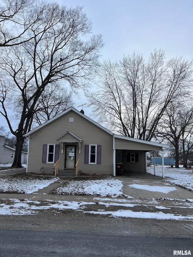 view of front of home featuring a carport