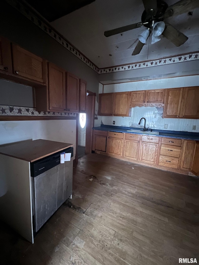 kitchen featuring ceiling fan, sink, and hardwood / wood-style floors