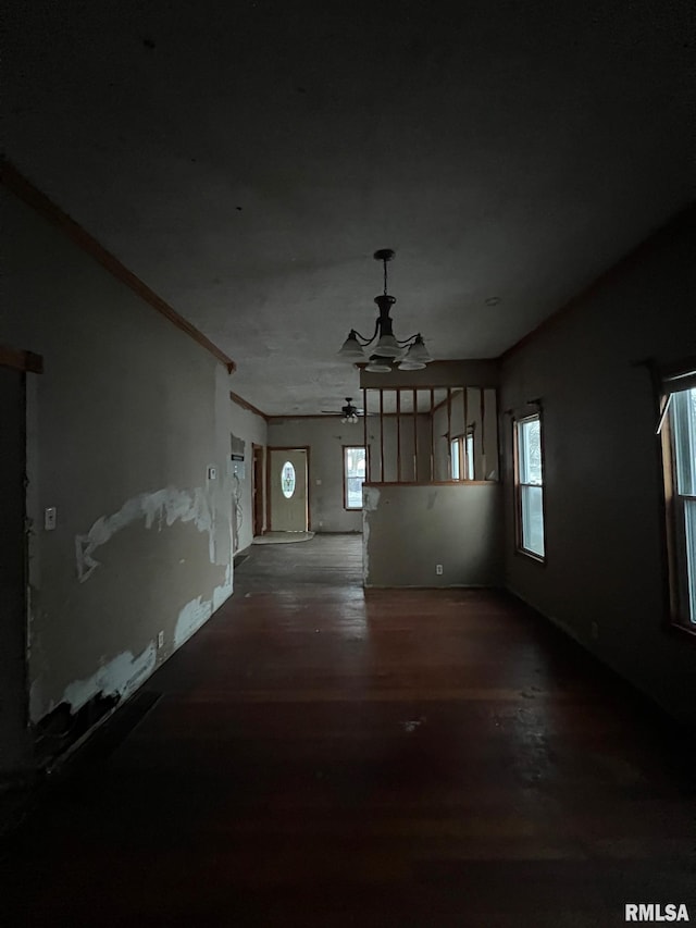 spare room featuring crown molding, hardwood / wood-style flooring, plenty of natural light, and ceiling fan