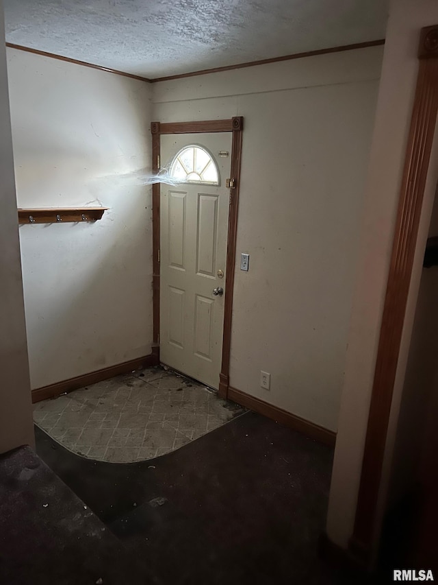 entrance foyer featuring a textured ceiling