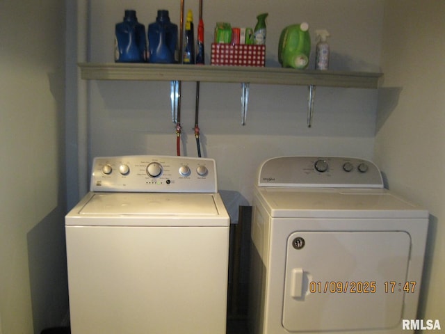 laundry room with washing machine and clothes dryer