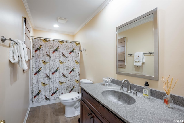 bathroom with toilet, a shower with curtain, wood-type flooring, ornamental molding, and vanity