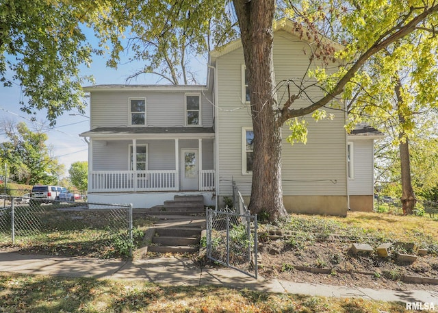 front of property featuring covered porch