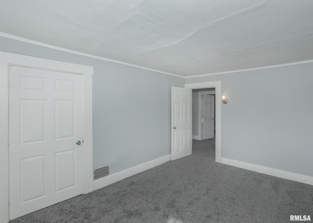 carpeted empty room featuring ornamental molding