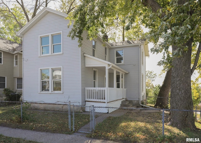 view of property featuring covered porch