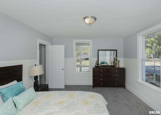 carpeted bedroom with a fireplace