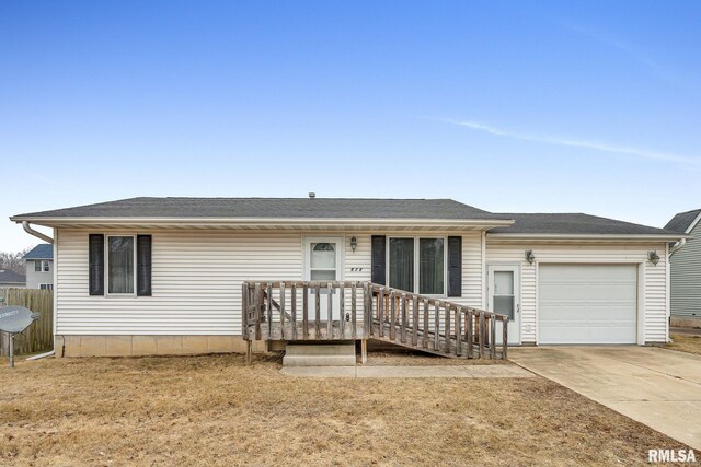 view of front of property with a garage and a front yard