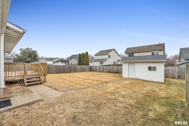 view of yard with an outbuilding and a deck