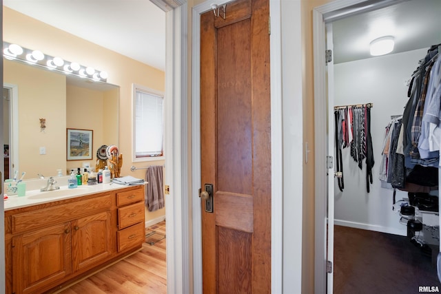 bathroom with vanity and hardwood / wood-style floors