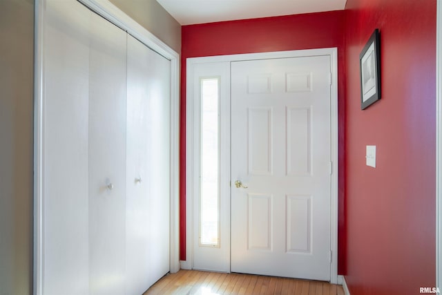 foyer entrance with light hardwood / wood-style floors