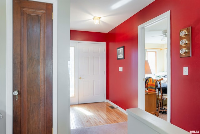 foyer entrance with light wood-type flooring