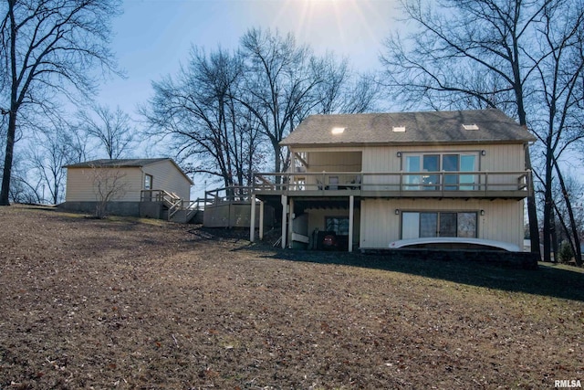 rear view of house with a deck