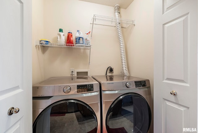 washroom with independent washer and dryer