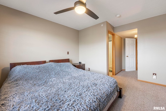 bedroom with ceiling fan and light carpet