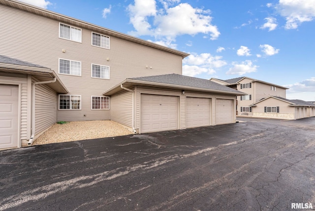 exterior space with a garage