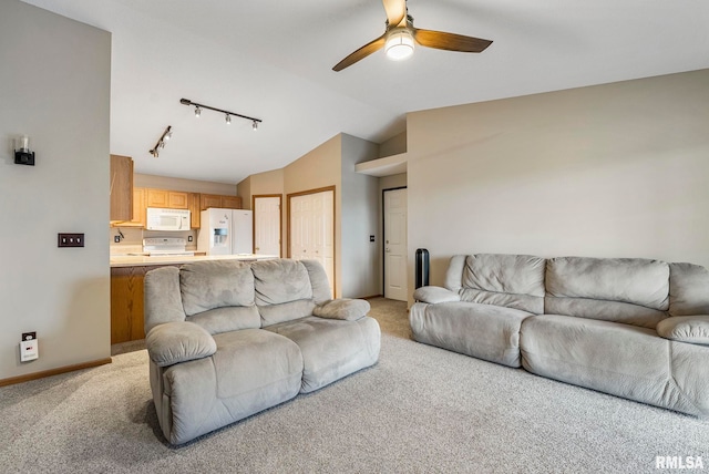 living room featuring ceiling fan, lofted ceiling, track lighting, and light carpet