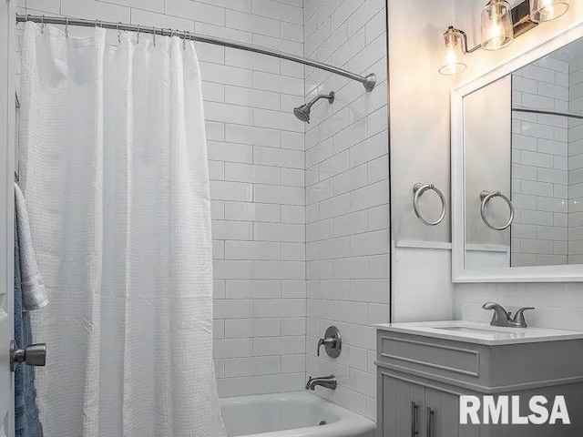 bathroom featuring vanity and shower / bath combo