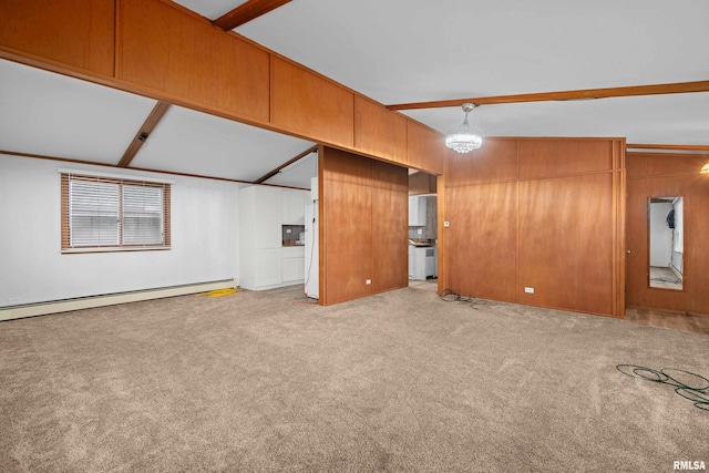 unfurnished living room featuring vaulted ceiling with beams, light carpet, baseboard heating, and wood walls