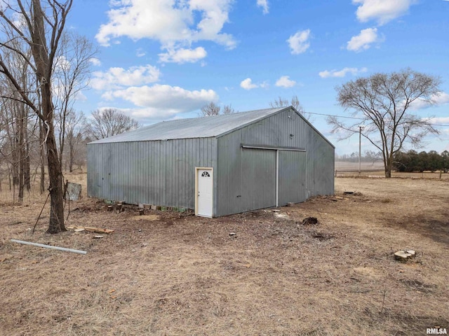 view of outbuilding featuring a rural view