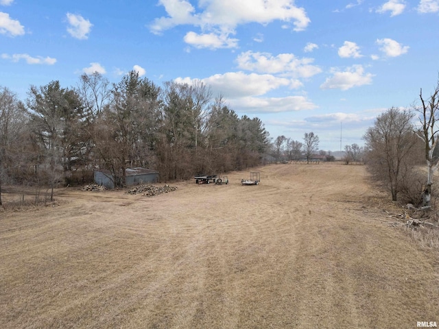 view of yard with a rural view