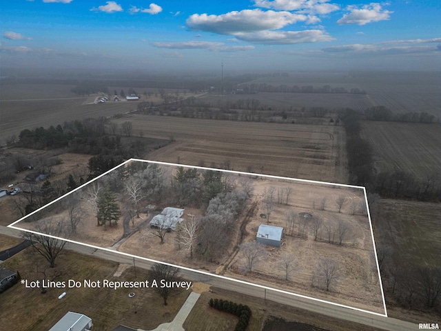 birds eye view of property with a rural view