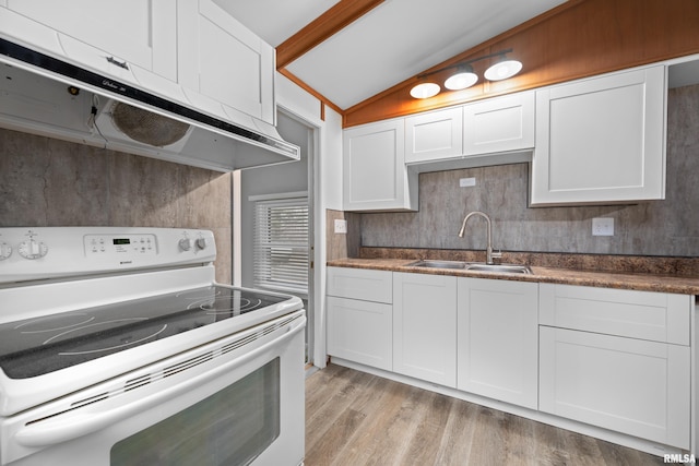 kitchen featuring white cabinetry, sink, and white range with electric stovetop