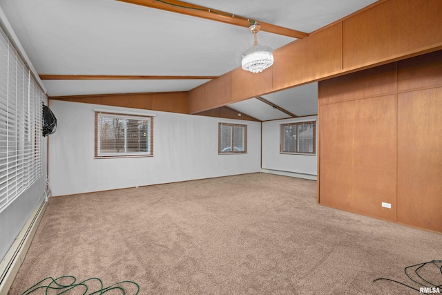 interior space featuring a baseboard radiator and vaulted ceiling with beams