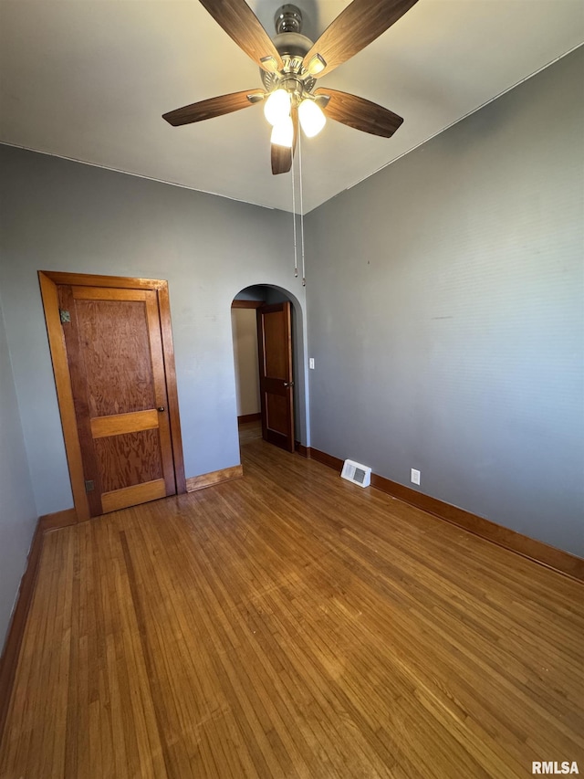 unfurnished bedroom with hardwood / wood-style floors and ceiling fan