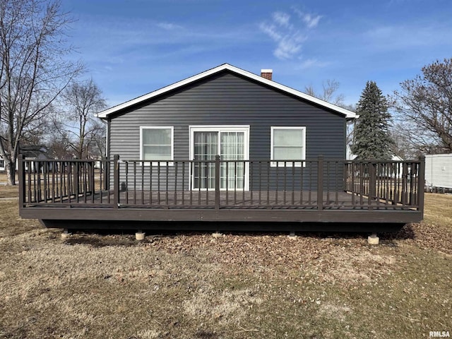 rear view of house with a wooden deck