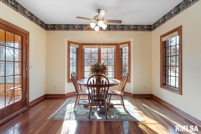 unfurnished dining area featuring ceiling fan and hardwood / wood-style floors