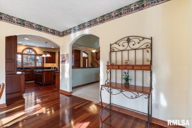 interior space with dark hardwood / wood-style floors