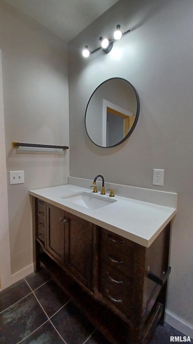 822 6th Ave S, Clinton, IA 52732 - bathroom featuring tile patterned floors and vanity