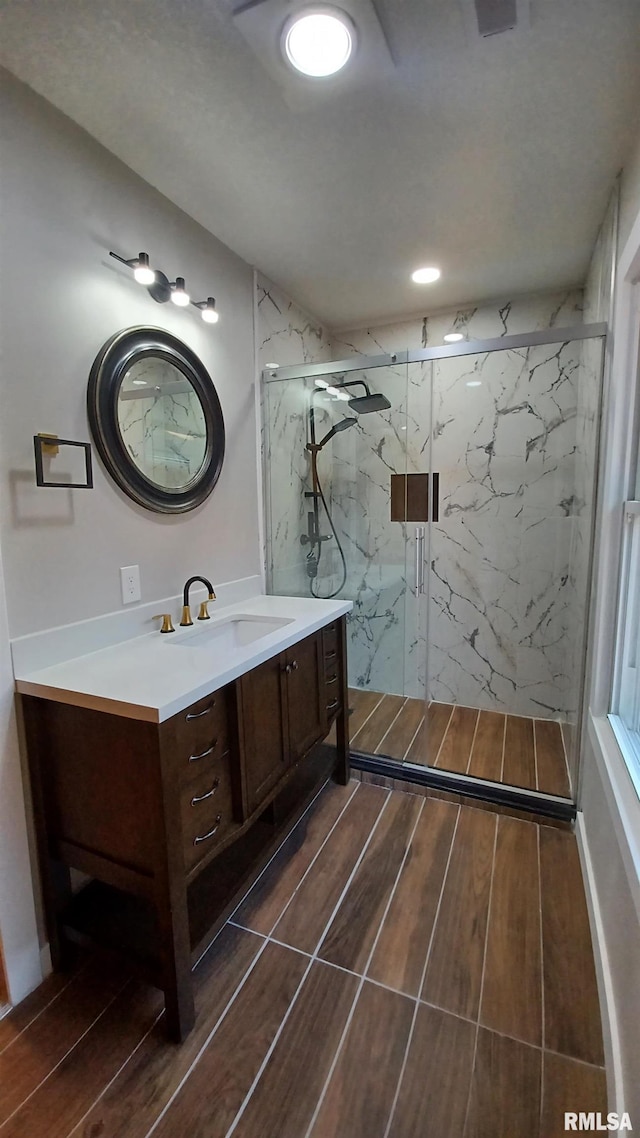 822 6th Ave S, Clinton, IA 52732 - bathroom featuring vanity and an enclosed shower