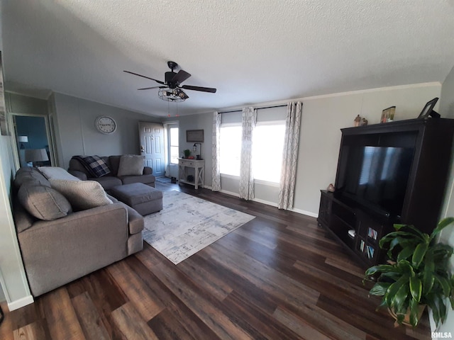 living room with ceiling fan, dark hardwood / wood-style floors, and a textured ceiling