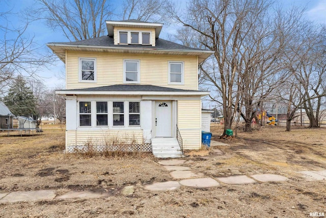 view of front of property with a trampoline