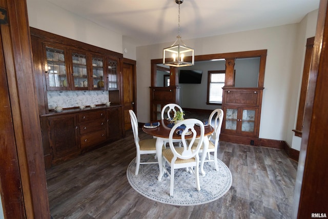 dining area with dark hardwood / wood-style flooring