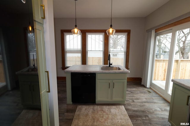 kitchen featuring sink, hanging light fixtures, dark hardwood / wood-style flooring, black dishwasher, and green cabinets