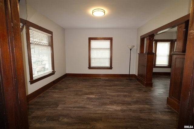 spare room with dark hardwood / wood-style floors