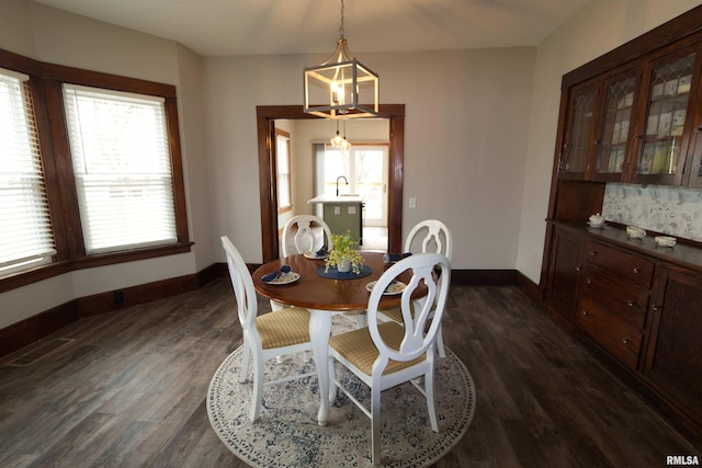 dining space with sink and dark hardwood / wood-style floors