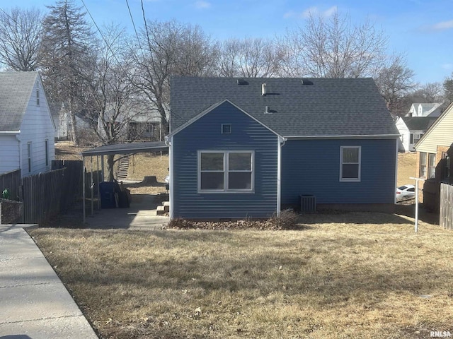 rear view of property with a yard, a patio area, and central air condition unit