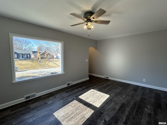 unfurnished room featuring dark hardwood / wood-style floors and ceiling fan