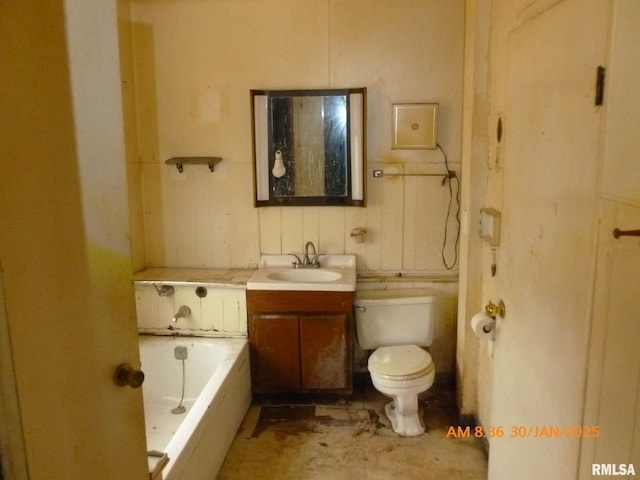 bathroom with vanity, a bath, and toilet