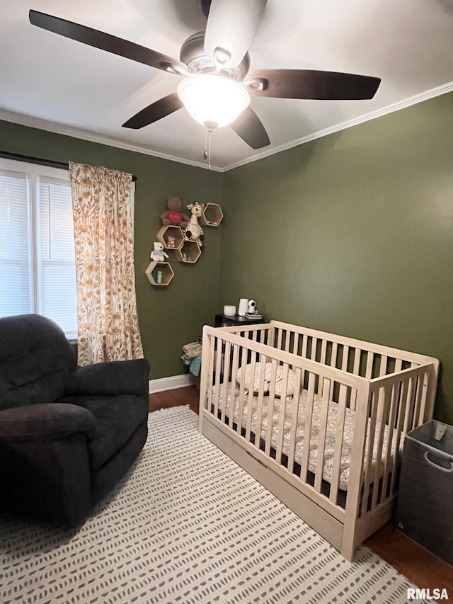 bedroom with ornamental molding and ceiling fan