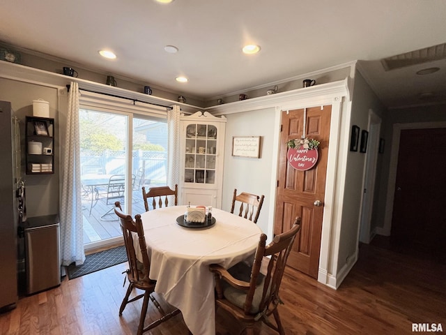 dining area featuring dark wood-type flooring