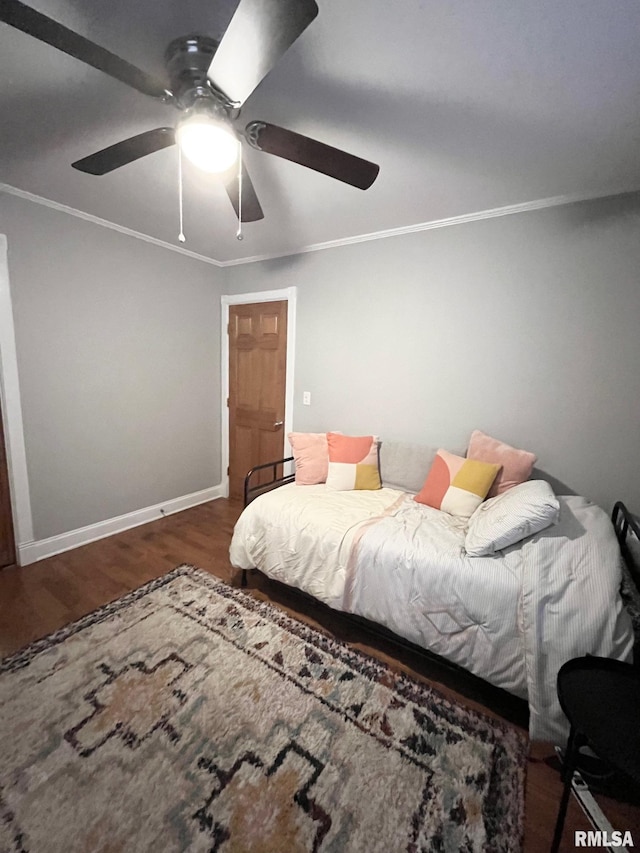 bedroom featuring crown molding, ceiling fan, and dark hardwood / wood-style floors