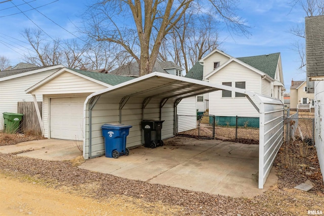 view of vehicle parking with a carport and a garage