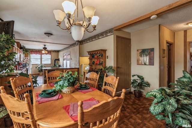 dining area with ceiling fan with notable chandelier and parquet floors